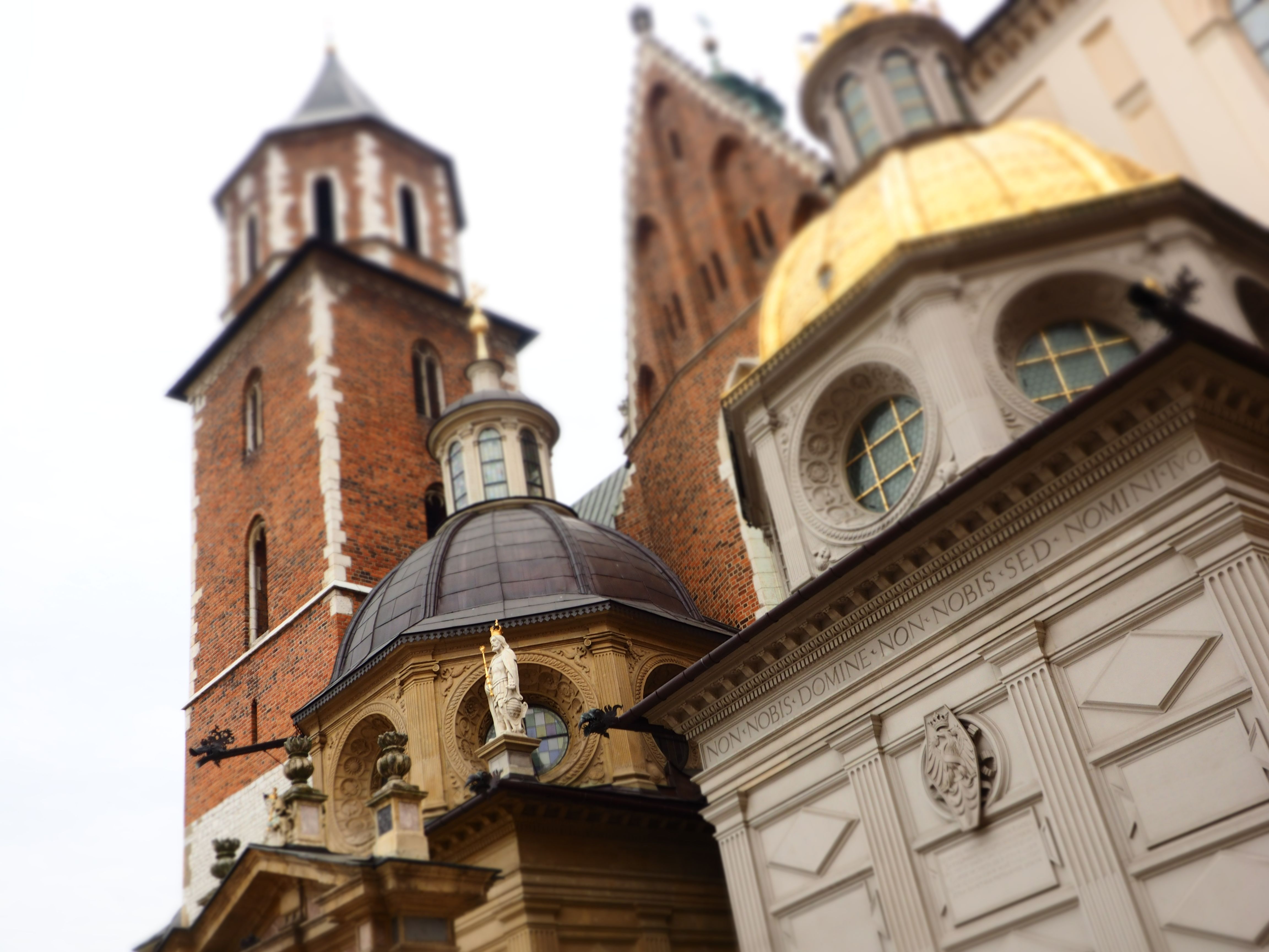 Wawel Castle with the Wawel Cathedral in the background. The castle is made up of many towers. Image: Alison Binney